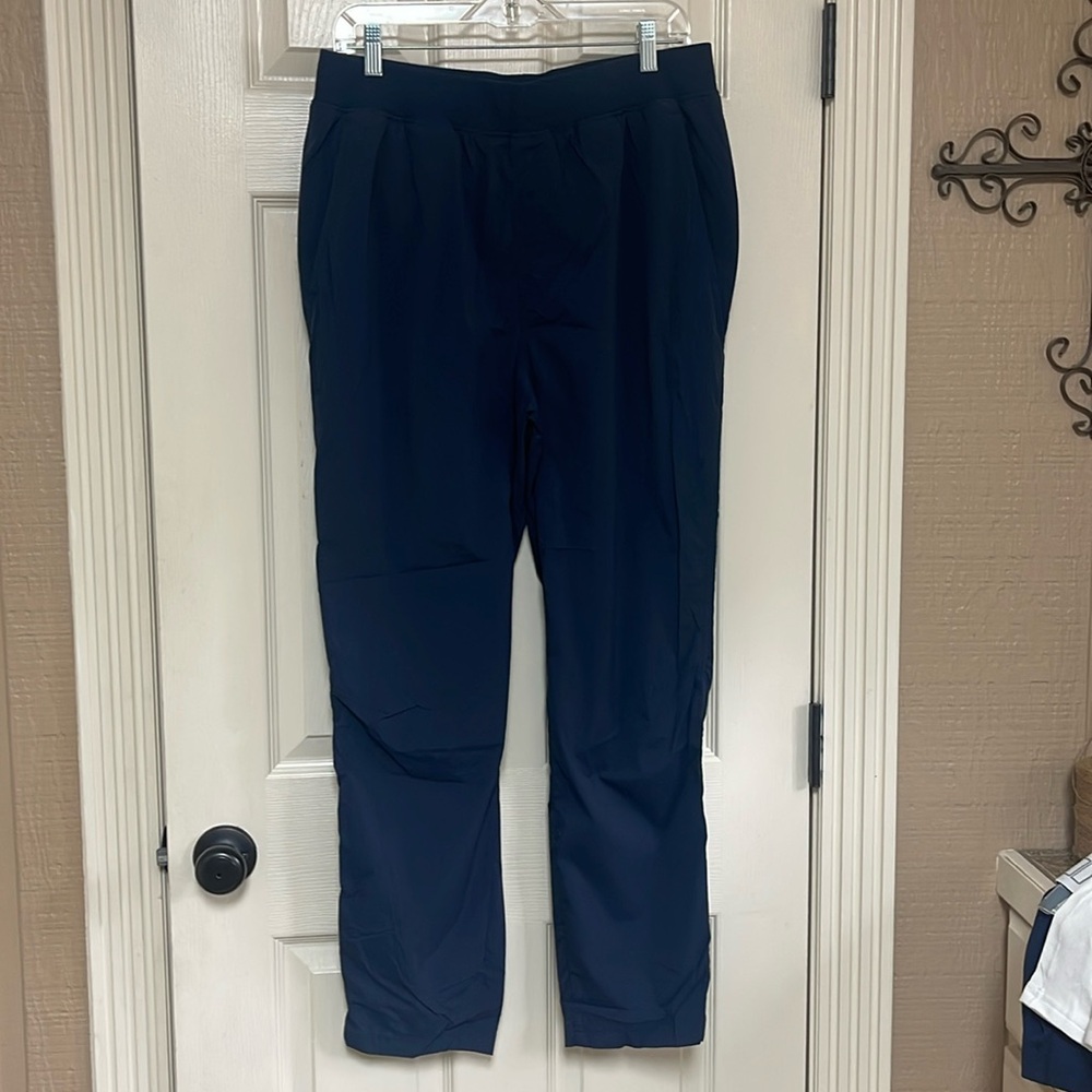 Wilson unlined navy blue wind pants. Size XL. Pockets in front and one in back.